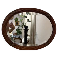 Ancien miroir ovale biseauté cadre en bois et décors bronze style Louis XVI