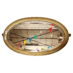 Ancien miroir ovale à parclose dorée ,c verre biseauté
