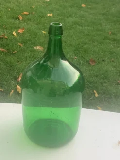 Dame jeanne en verre verte vintage