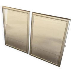 Deux Miroirs biseautés avec encadrement en finition effet or blanc vieilli