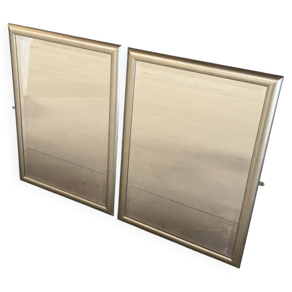 Deux Miroirs biseautés avec encadrement en finition effet or blanc vieilli