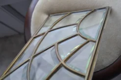 Deux vitraux en verre biseauté et laiton