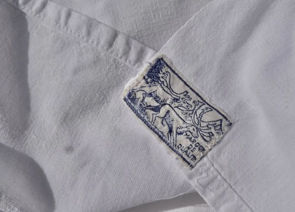 Drap ancien en métis, monogrammé FS avec jour Venise