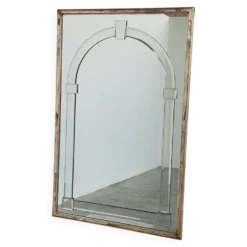 Grand miroir mural en verre biseauté de style Art Déco avec design d'arc architectural.