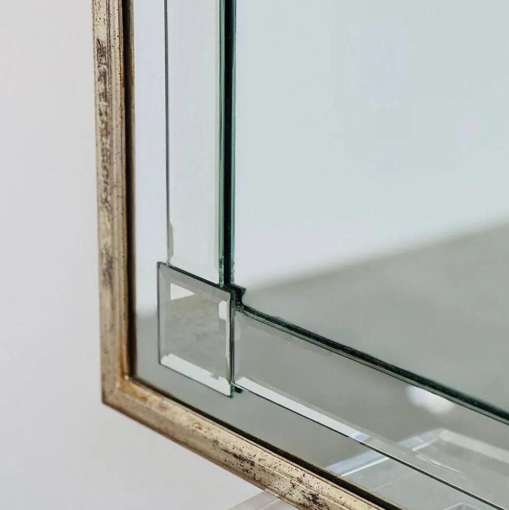Grand miroir mural en verre biseauté de style Art Déco avec design d'arc architectural.