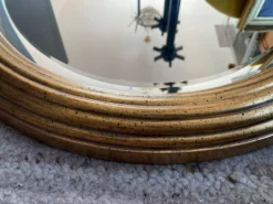 Grand miroir Ovale Deknudt en bois doré années 70