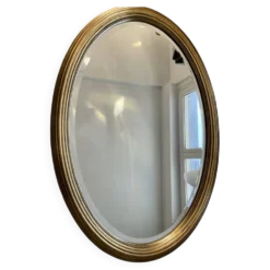 Grand miroir Ovale Deknudt en bois doré années 70
