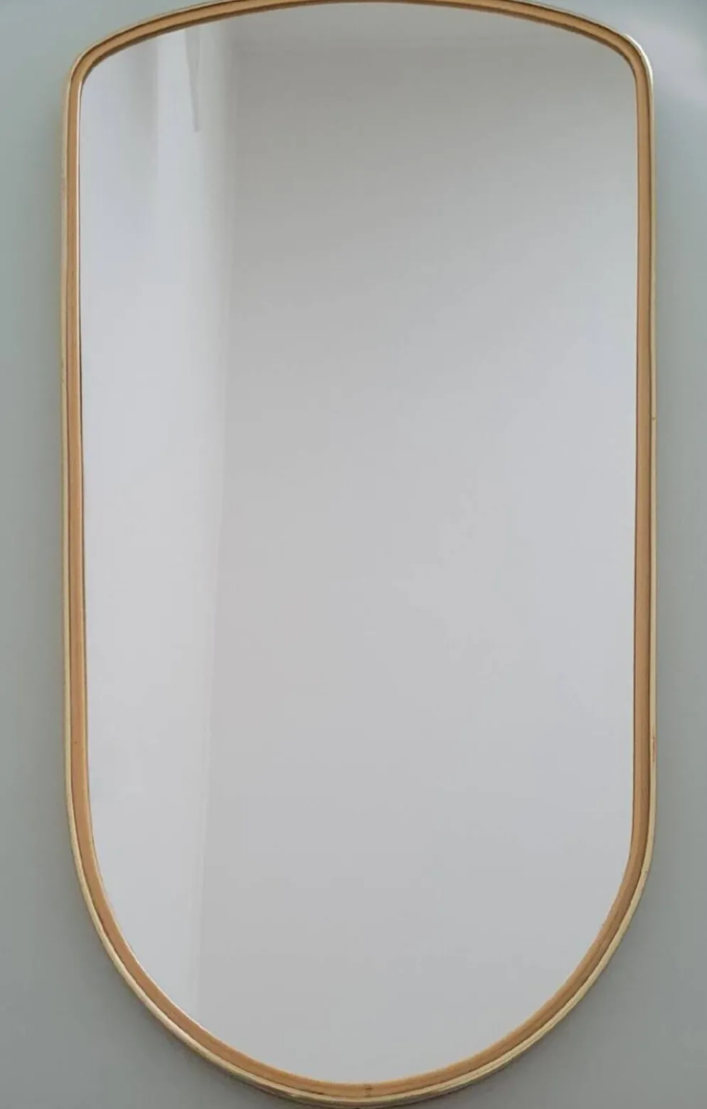 Grand miroir ovoïde vintage à bords dorés et noir - années 1960