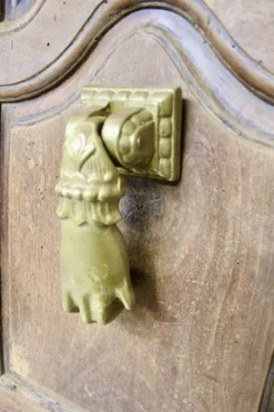 Heurtoir en bronze plein, forme de main, XIXème