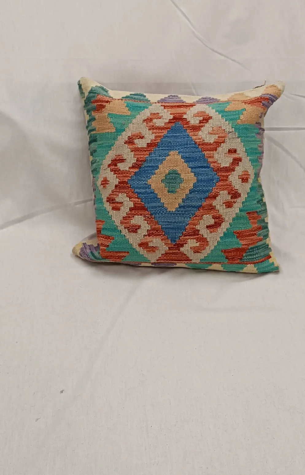 Housse de coussin géométrique turquoise, coussin en laine kilim vintage pour décoration intérieure.
