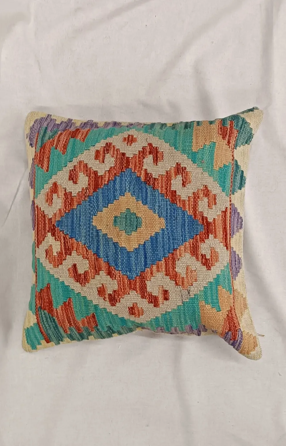 Housse de coussin géométrique turquoise, coussin en laine kilim vintage pour décoration intérieure.