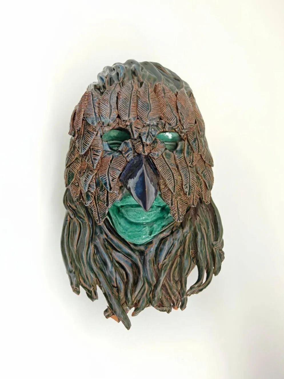 Masque mural en terre cuite