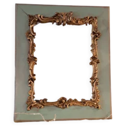 Miroir ancien de style Louis XV en bois et stuc doré.