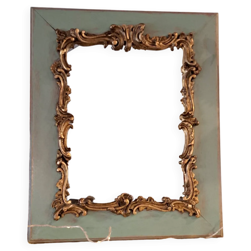Miroir ancien de style Louis XV en bois et stuc doré.