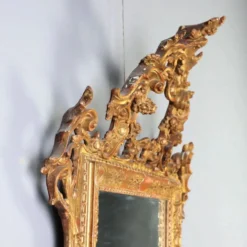 Miroir ancien en bois sculpté et doré, Italie, début XXe siècle