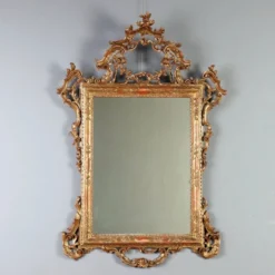 Miroir ancien en bois sculpté et doré, Italie, début XXe siècle
