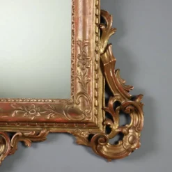 Miroir ancien en bois sculpté et doré, Italie, début XXe siècle