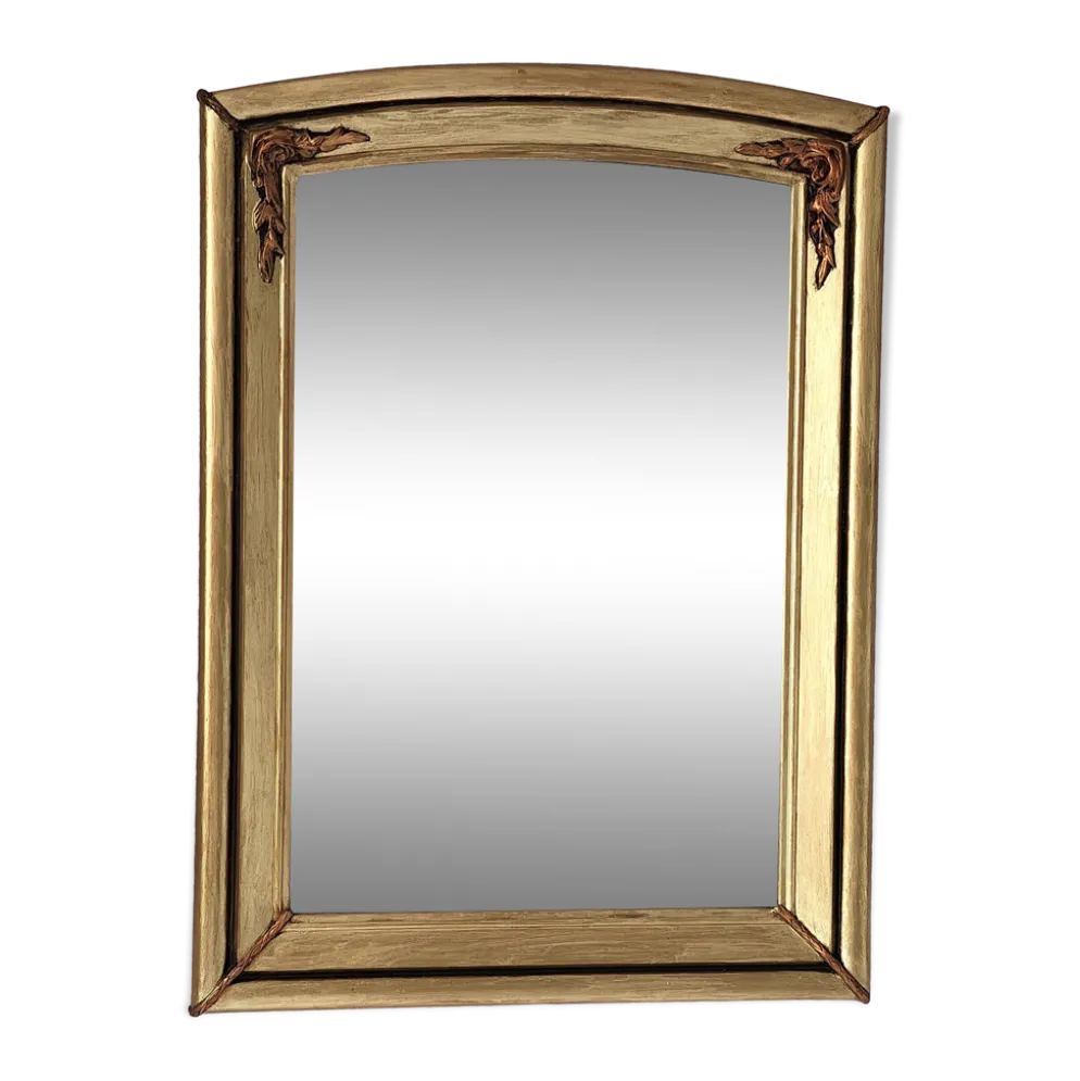 Miroir art déco en bois doré et cintré aux décorations florales