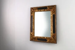 Miroir baroque en bois noir et doré sculpté, France années 1850.