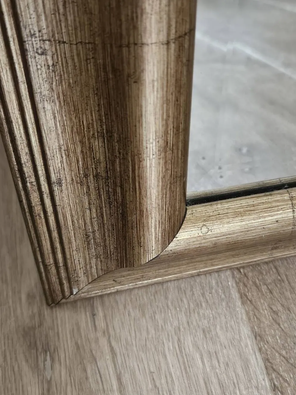 Miroir biseauté sous cadre doré