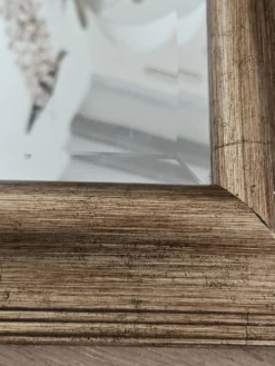 Miroir biseauté sous cadre doré