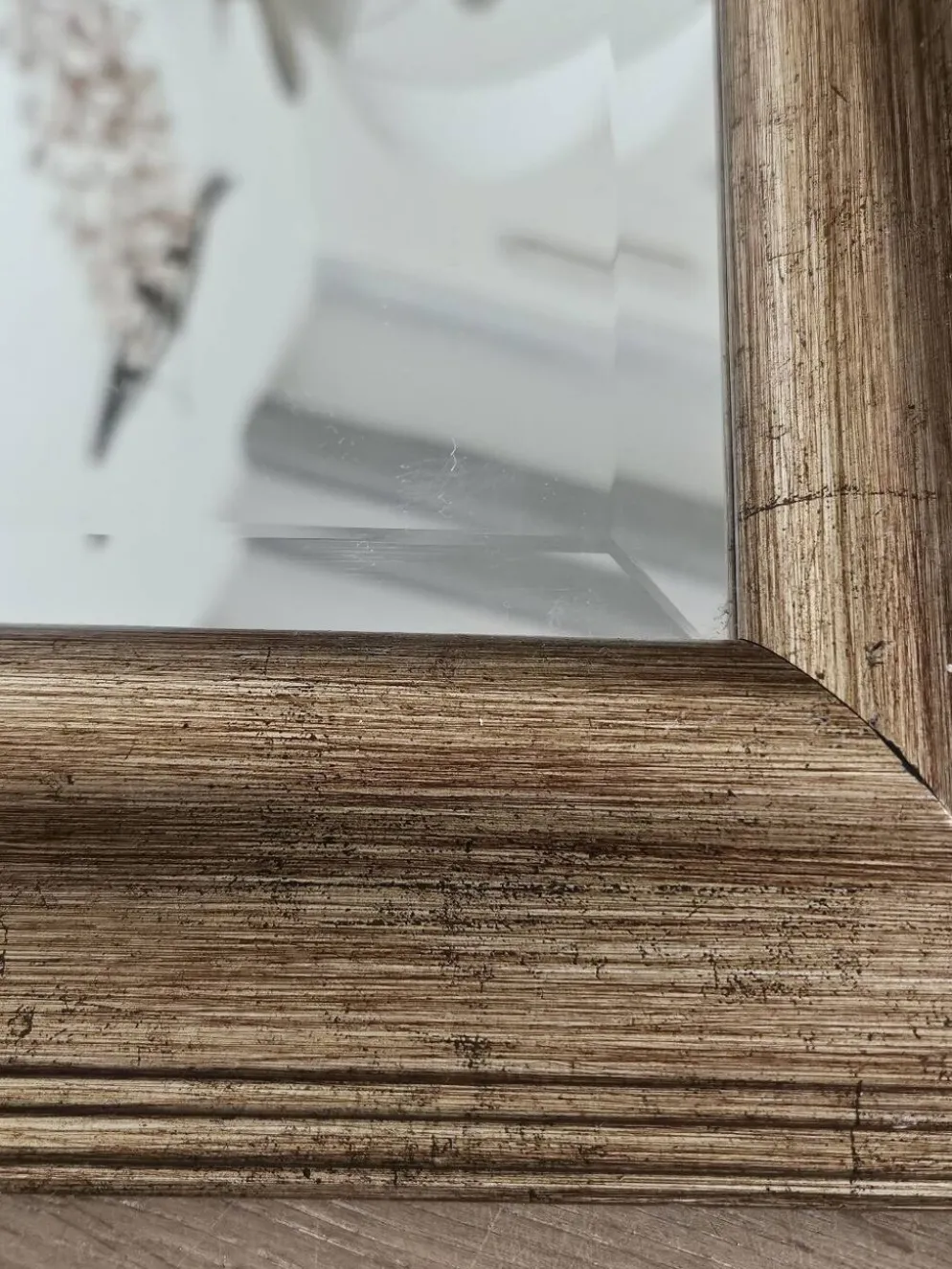 Miroir biseauté sous cadre doré
