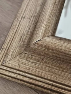 Miroir biseauté sous cadre doré