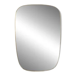 Miroir cerclé de laiton doré. 1980