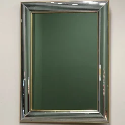 Miroir « Disco » DeKnudt des années 1980, avec cadre biseauté à plusieurs niveaux et bordure dorée.
