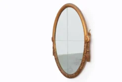 Miroir en chêne doré ovale français sculpté art déco, vers 1925