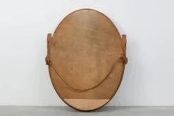 Miroir en chêne doré ovale français sculpté art déco, vers 1925