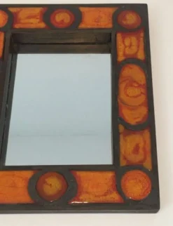 Miroir en céramique dans les tons orangés