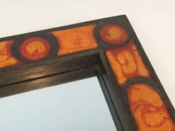 Miroir en céramique dans les tons orangés
