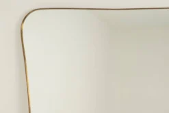 Miroir en laiton doré dans le style de Gio Ponti. Années 1980/90.