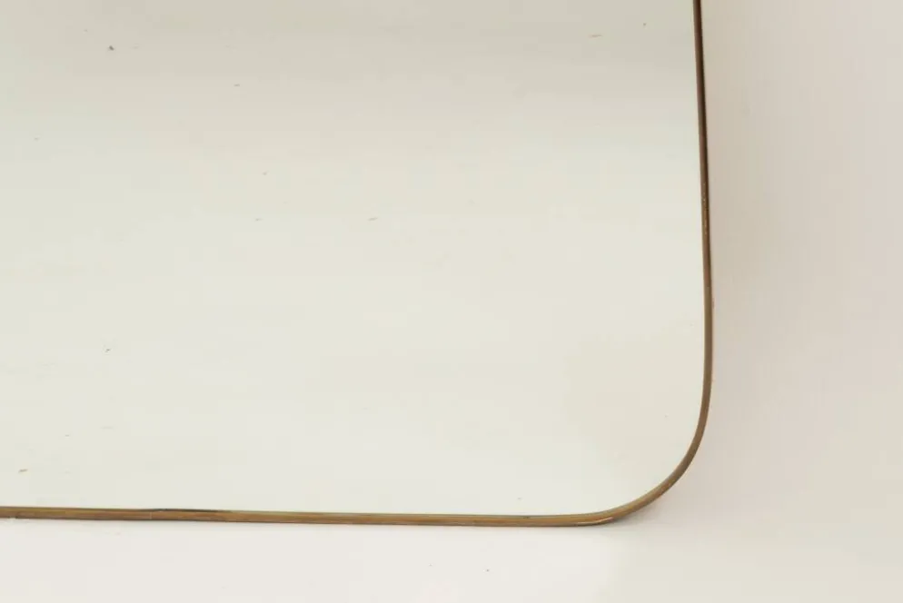 Miroir en laiton doré dans le style de Gio Ponti. Années 1980/90.