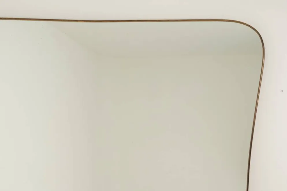 Miroir en laiton doré dans le style de Gio Ponti. Années 1980/90.