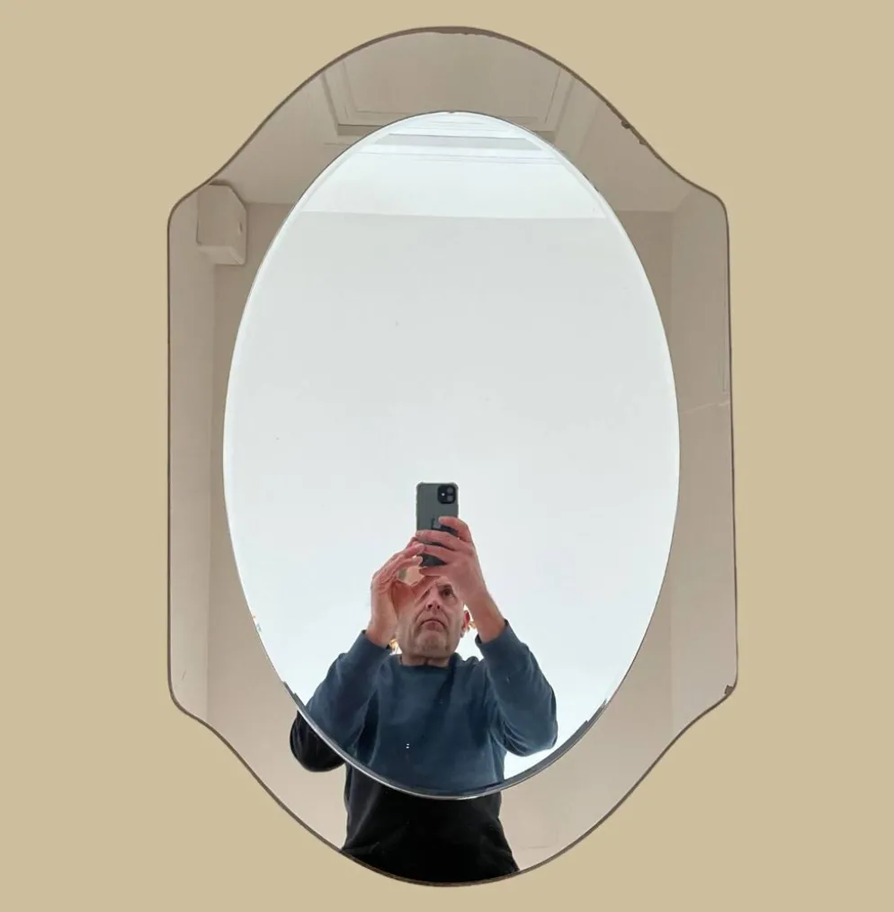 Miroir en verre fumé bicolore, vers 1970