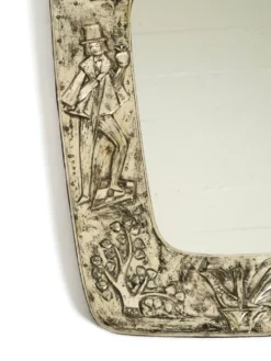 Miroir mural de style mid-century moderne avec un cadre en argent.