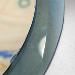 Miroir mural rond en verre fumé superposé de style mid-century modern, attribué à Cristal.