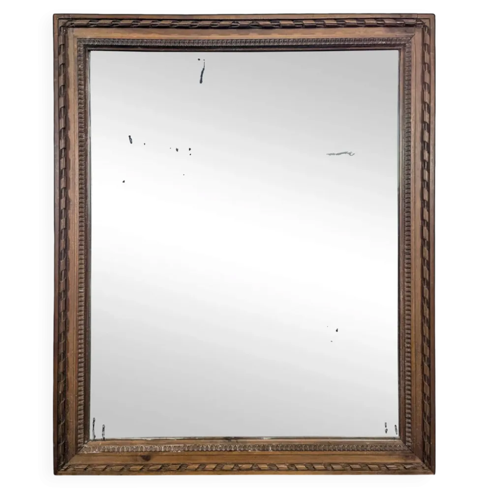 Miroir Napoléon III à cadre en bois sculpté et doré