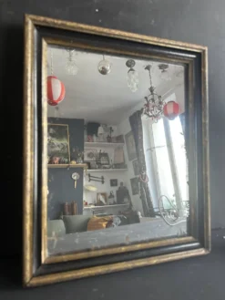 Miroir Napoléon III en bois noir et doré, XIXe siècle
