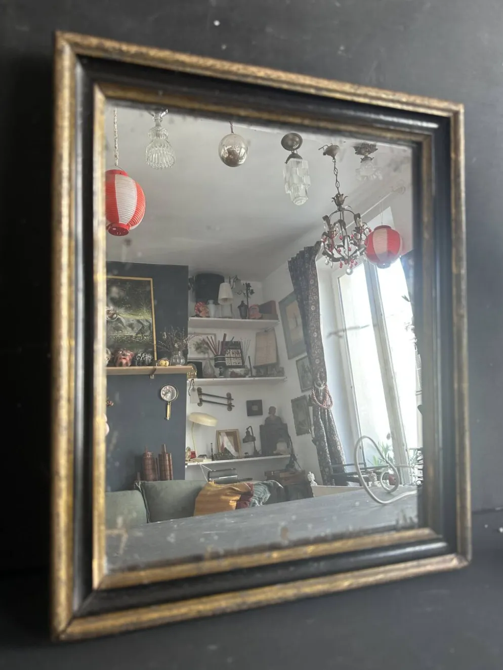 Miroir Napoléon III en bois noir et doré, XIXe siècle