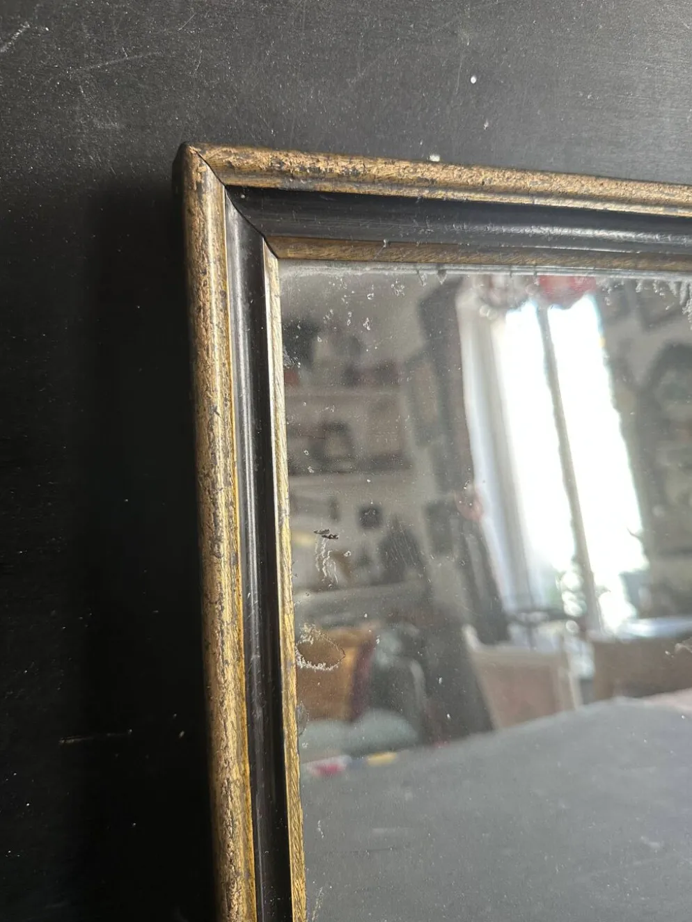 Miroir Napoléon III en bois noir et doré, XIXe siècle
