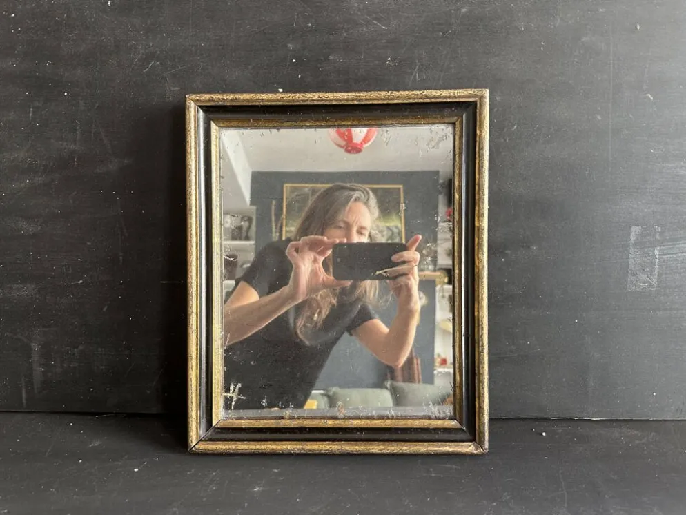Miroir Napoléon III en bois noir et doré, XIXe siècle