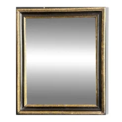 Miroir Napoléon III en bois noir et doré, XIXe siècle
