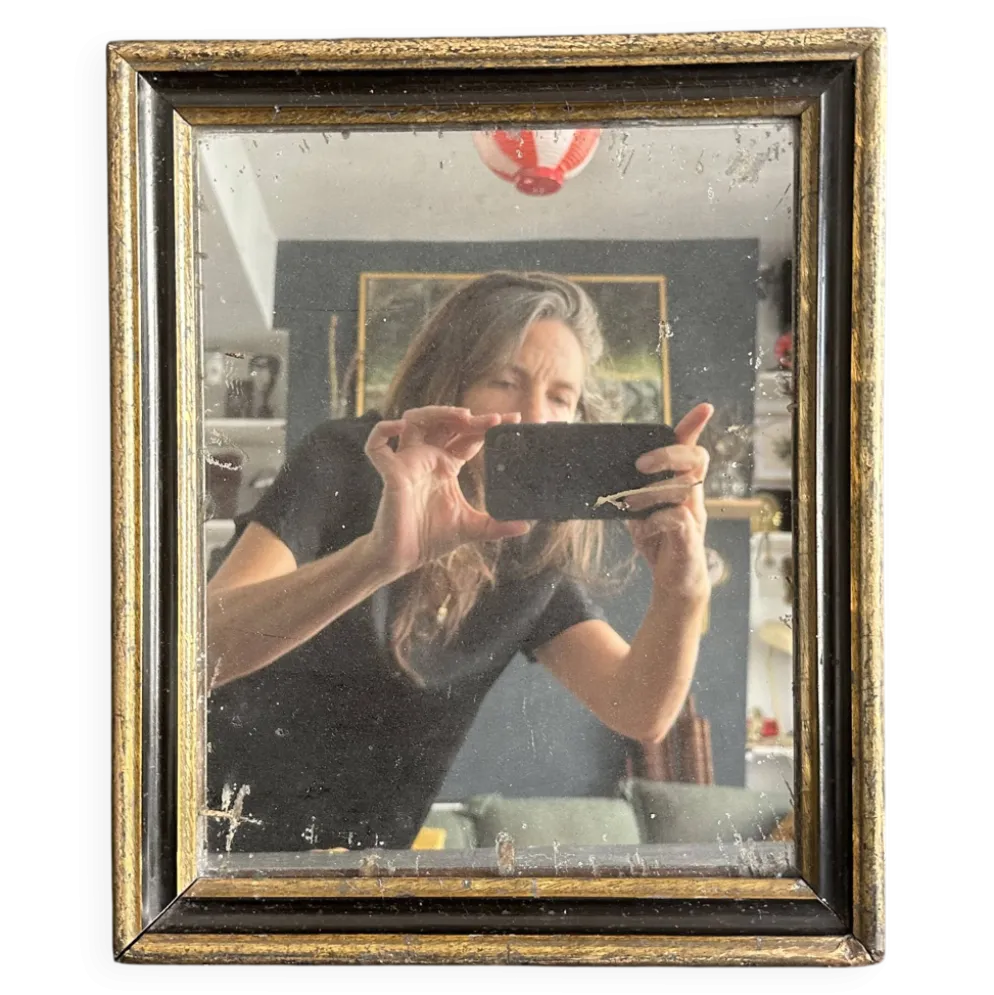 Miroir Napoléon III en bois noir et doré, XIXe siècle