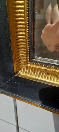 Miroir noir et dore de style art deco