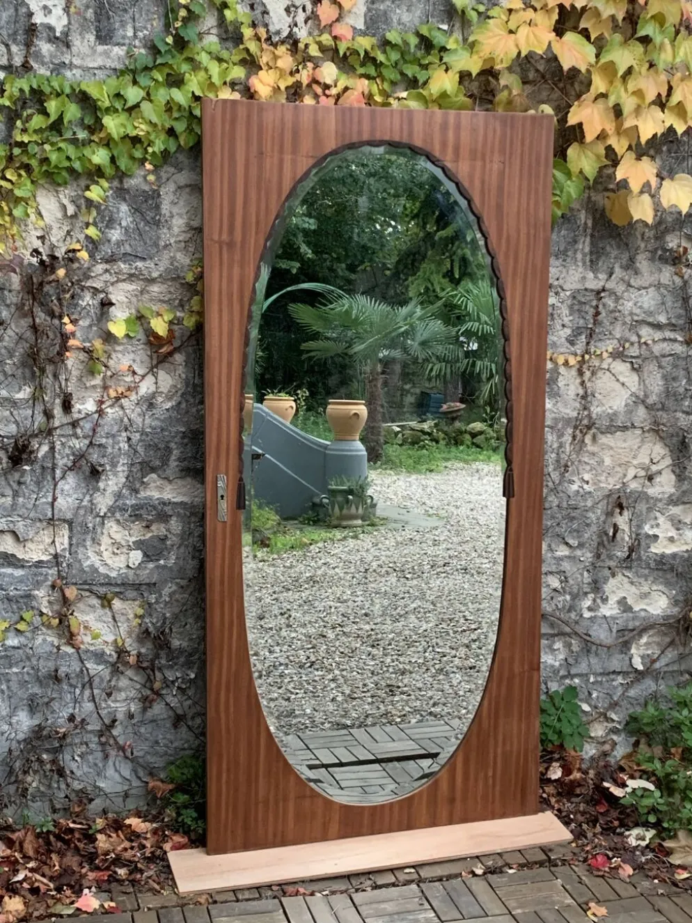 Miroir oval biseauté sur porte art déco Acajou 79x162