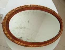 Miroir ovale ancien glace biseauté en bois et stuc XIXeme