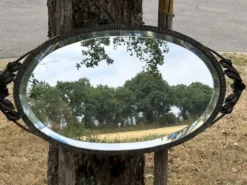 Miroir ovale biseauté art déco fer forgé richement travaillé